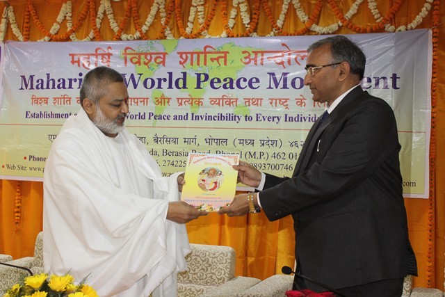 Brahmachari Girish Ji presenting Maharishi Book to GM Shri Patel Ji.